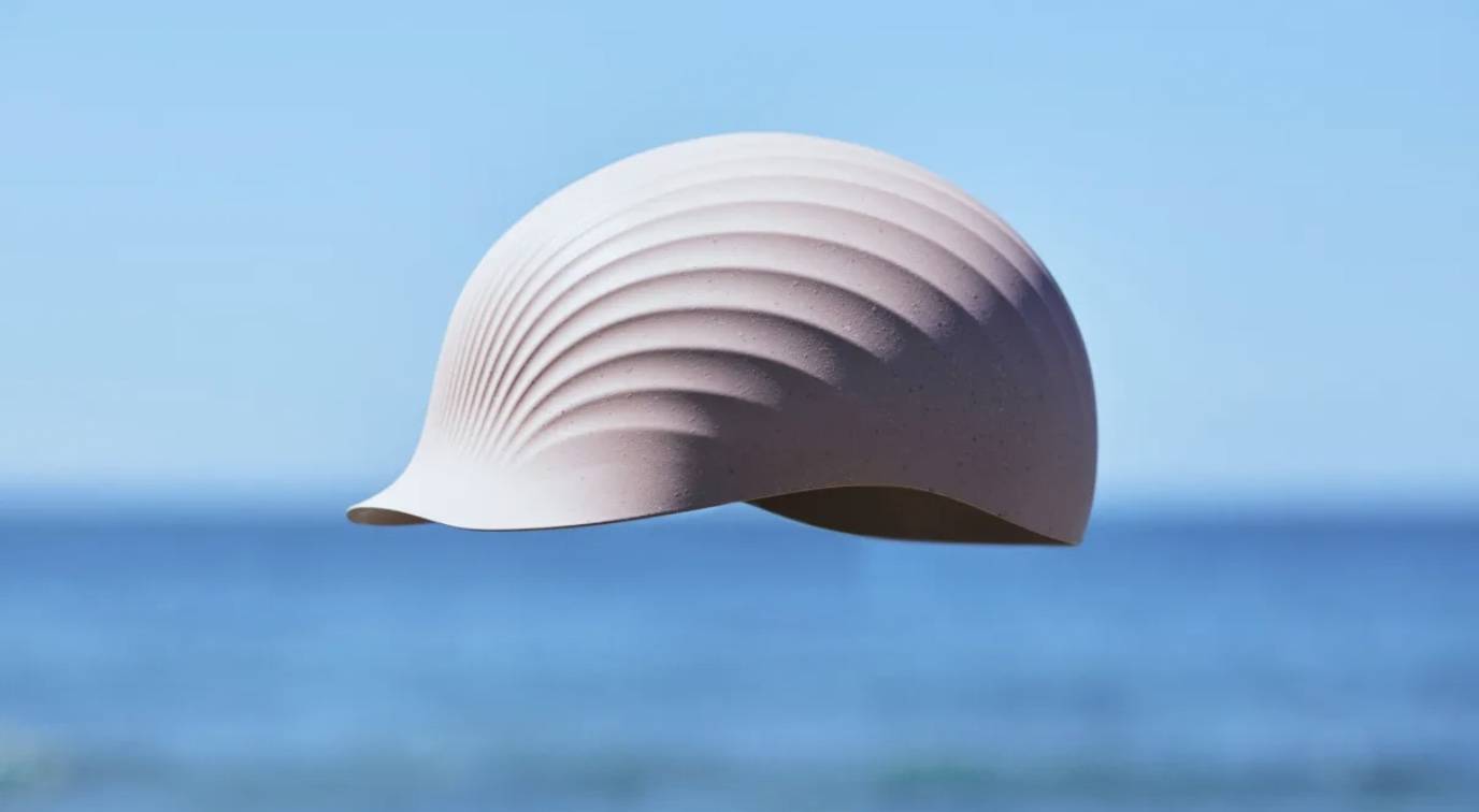 Screen Shot 2023-07-24 at 10.39.23 AM Floating Shellmet helmet in the foreground. Blurred ocean in the background